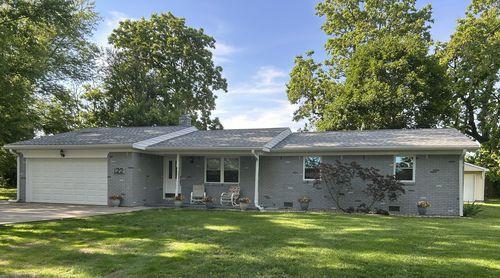 Front of house with detached garage in back