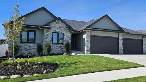 Beautifully landscaped 3 bedroom contemporary home with large 8 car garage