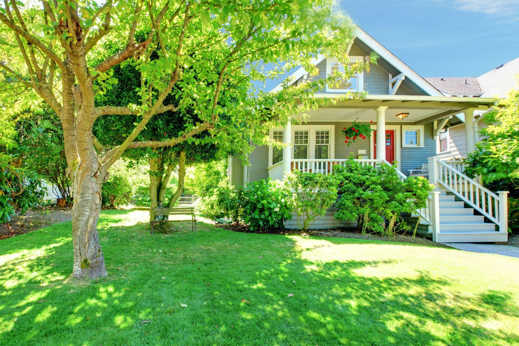 16727895 - grey old american house with summer  green landscape.