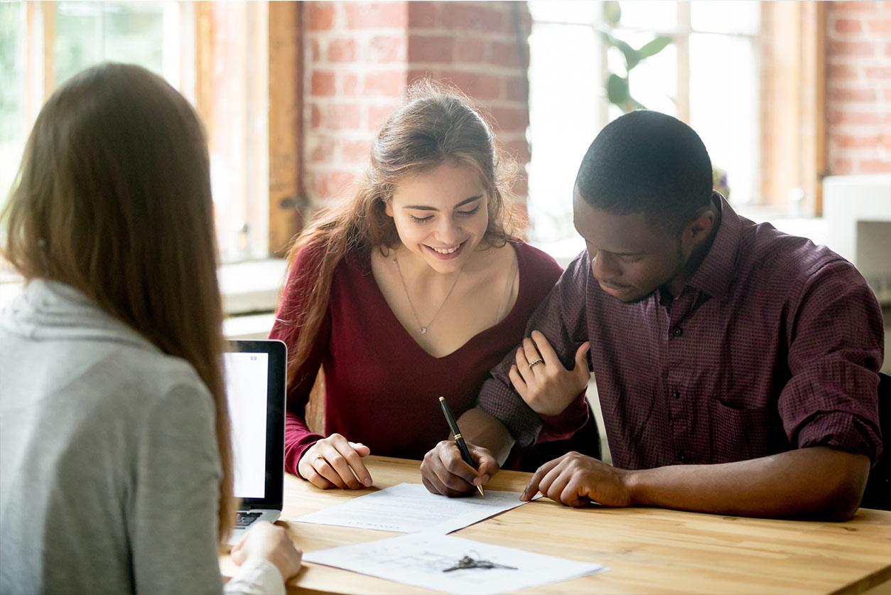 couple signing title insurance