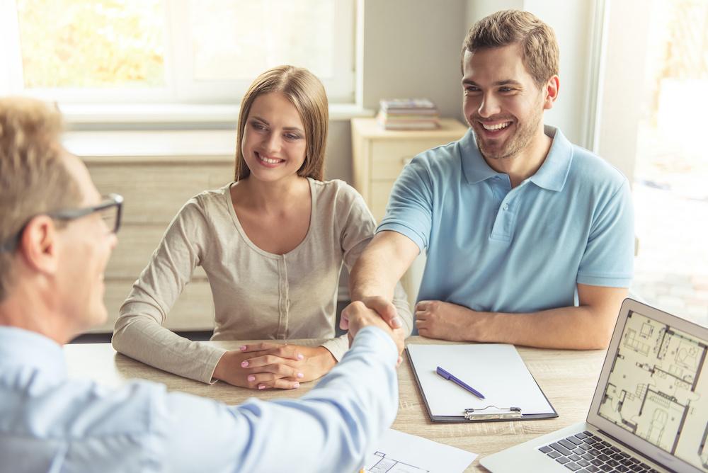 couple negotiating with home seller
