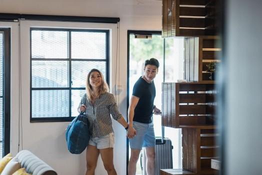 Couple walking into a new home for the first time.