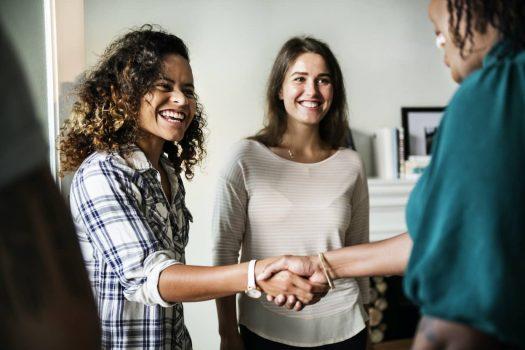 women shaking hands