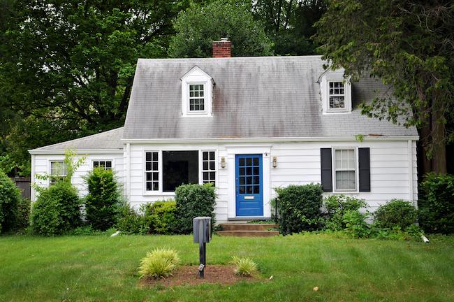 White colored house with blue door